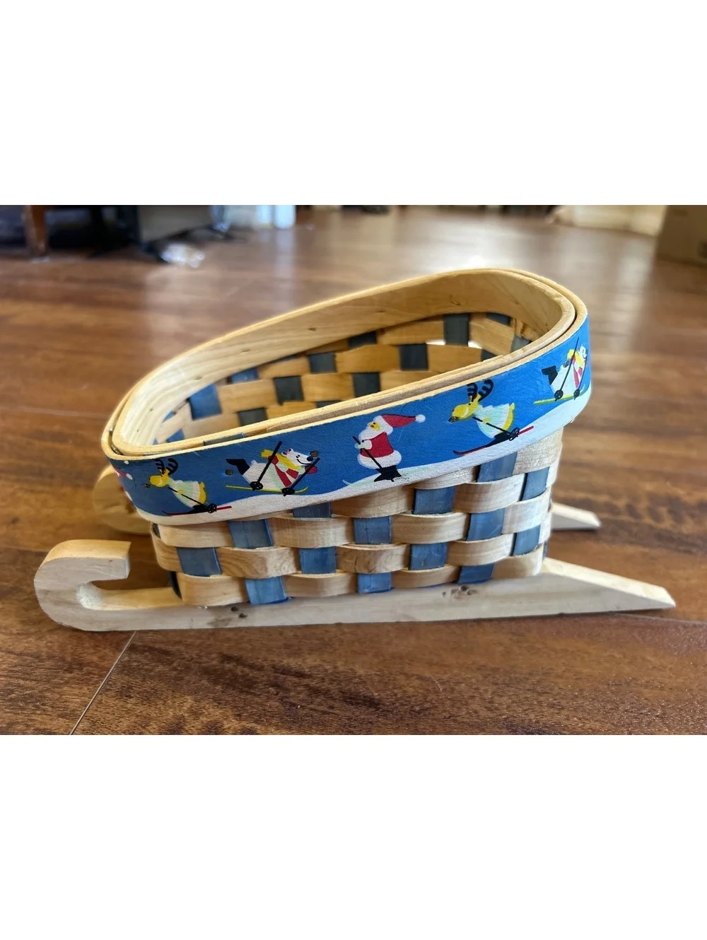 Handwoven Wooden Sled Basket with Festive Skiing Santa and Reindeer Trim